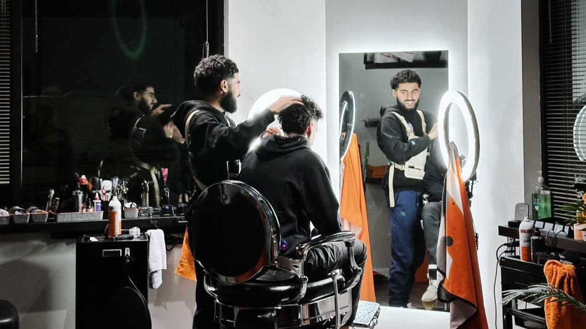 Barber MoeB standing in his private Canton studio