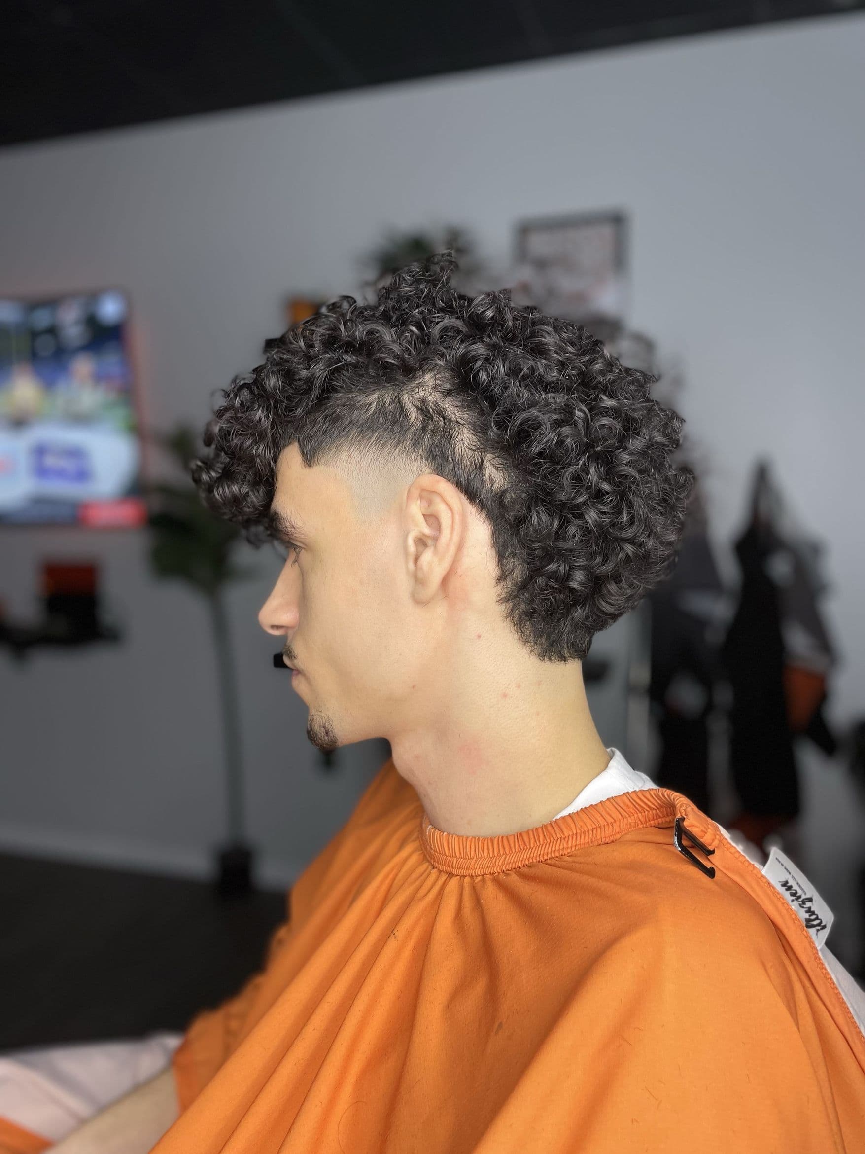 Close-up of a crisp fade detail by Barber MoeB